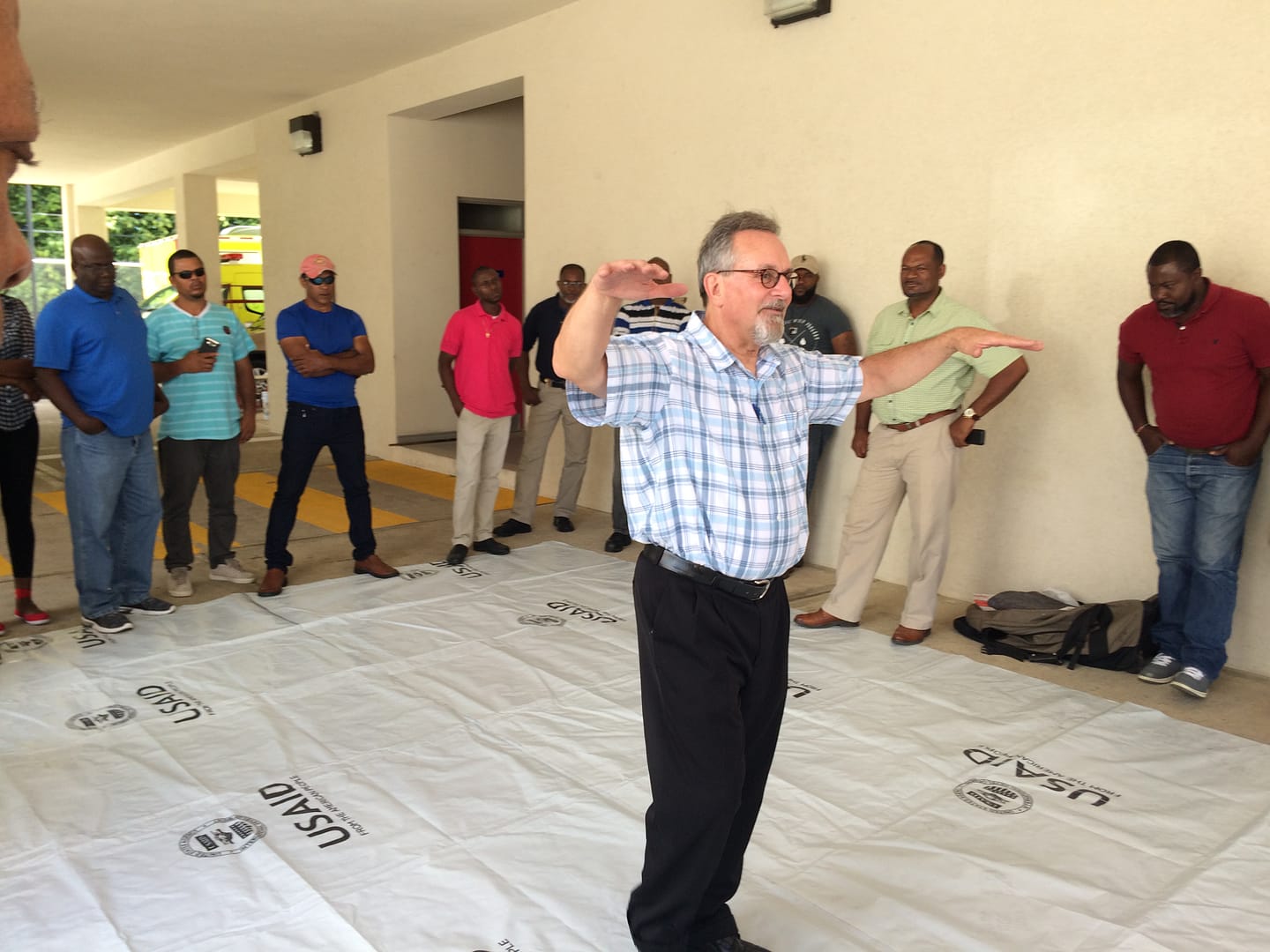 Particpants are all ears as Chuck conducts the Plastic Sheeting Training