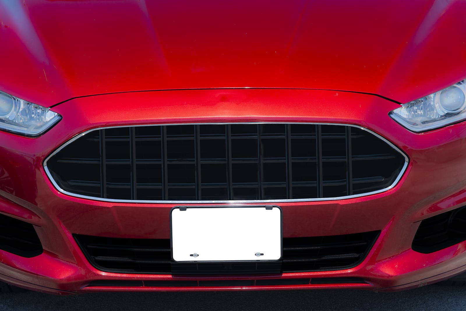 Horizontal Shot Of A Red Automobile With A Blank White Front Lic