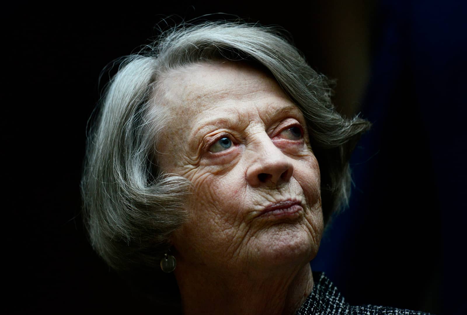 Downton Abbey cast member Maggie Smith poses for the media at a hotel in London