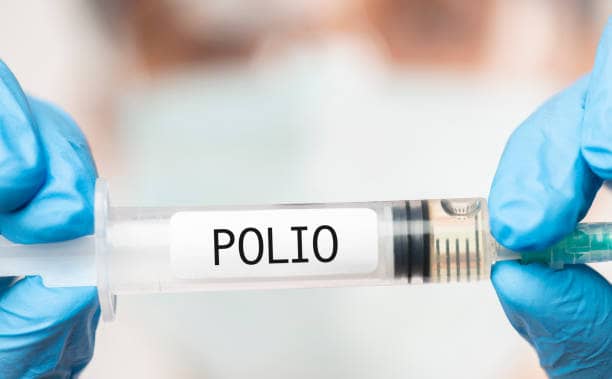 Doctor showing Polio Vaccine.