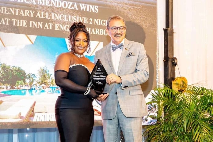 Tammica Mendoza being presented with the – Rising Star Award at the annual ABHTA Tourism Awards by Tourism Minister Charles Max Fernandez. 