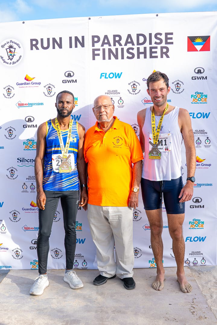 L-R Half Marathon (21K), 1st place winner Kamar Thomas, Stanley Humphreys Event organizer and 2nd place winner Dr. Peter Borowsky